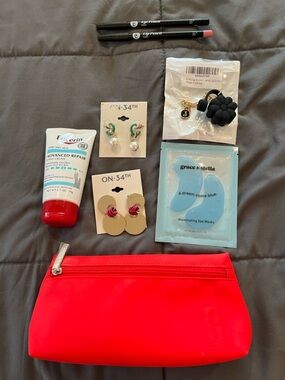 Clinique Red Cosmetic Pouch - Filled with beauty accessories.